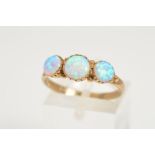 A 9CT GOLD OPAL RING, designed as three graduated circular opal cabochons to the plain polished