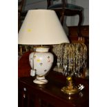 A DECORATIVE CERAMIC TABLE LAMP with a shade together with a brassed table lamp with glass