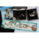 A SELECTION OF FIVE NECKLACES AND TWO BRACELETS, including a cubic zirconia pendant necklace,