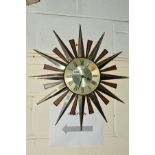 A METAMIC QUARTZ SUNBURST WALL CLOCK with arabic numerals, diameter 60cm (sd)