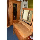AN EARLY 20TH CENTURY OAK TWO PIECE BEDROOM SUITE, comprising of a single mirror door wardrobe,