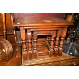 A REPRODUCTION OAK NEST OF THREE TABLES