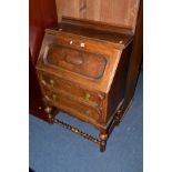 AN OAK BARLEY TWIST BUREAU with two drawers