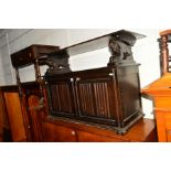 AN OAK LINENFIOLD MONKS BENCH and an oak drop leaf tea trolley (2)