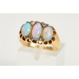 AN EDWARDIAN 18CT GOLD OPAL AND DIAMOND HALF HOOP RING, three oval opal cabochons measuring