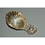 AN ELIZABETH II SILVER CADDY SPOON, with scallop shell handle and bowl, maker David Hollander & Son,