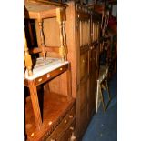 AN OAK LINENFOLD FOUR PIECE BEDROOM SUITE comprising of a double door wardrobe, dressing table