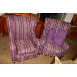 A PAIR OF MODERN PURPLE AND WHITE STRIPED UPHOLSTERED WING BACK ARMCHAIRS (missing one cushion) (2)