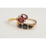 TWO GEM SET RINGS, the first designed as two oval cut garnets with brilliant cut diamond detail,