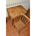 A MID 20TH CENTURY SMALL WOODEN SCHOOL DESK, with inkwell void (inkwell lacking), hinged top,