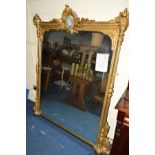 A MID 19TH CENTURY GILTWOOD OVERMANTEL MIRROR, of rectangular form, the pediment with swag and urn