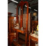 A VICTORIAN WALNUT HALL STAND, with a central mirror and seven coat hooks, width 74cm x height
