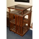 AN EARLY 20TH CENTURY OAK REVOLVING BOOKCASE, with open shelf below the top and the eight