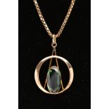 A 9CT GOLD PENDANT NECKLACE, the circular open work pendant with a central elongated oval green