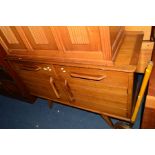 AN E GOMME TEAK SIDEBOARD with two long drawers above double cupboard doors and splayed legs,