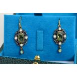 A PAIR OF PERIDOT AND OPAL DROP EARRINGS, each designed as a central oval peridot cabochon within