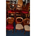 A SET OF SEVEN VICTORIAN WALNUT BALLOON BACK CHAIRS,two chairs with different seat pads
