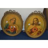 A PAIR OF 19TH CENTURY GILT PLASTER OVAL PICTURE FRAMES bearing images of Jesus and the Virgin Mary