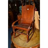 AN EDWARDIAN MAHOGANY BENTWOOD SEATED ROCKING CHAIR