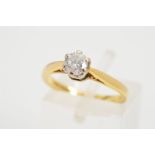 AN 18CT GOLD SINGLE ROUND DIAMOND RING, the brilliant cut diamond within a six claw setting to the