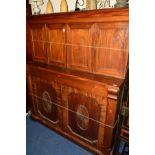 A VICTORIAN WALNUT AND MAHOGANY SIDEBOARD, moulded pediment above four panelled doors enclosing