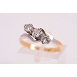 A THREE STONE DIAMOND RING, designed as three round brilliant cut diamonds in illusion settings to