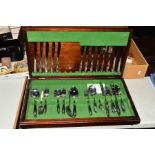 AN OLD HALL MAHOGANY STAINED CANTEEN, containing a set of Oneida stainless steel cutlery, floral
