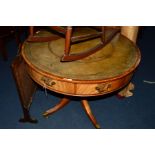 A REPRODUCTION MAHOGANY AND INLAID DRUM TABLE, with a green tooled leather inlay top, four drawers