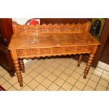 A VICTORIAN OAK SIDE TABLE, the foliate carved back above rectangular top, on bobbin turned legs,