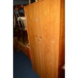 A 1960'S/70'S TEAK TWO PIECE BEDROOM SUITE, comprising of a double gentleman's wardrobe, width