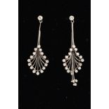 A PAIR OF DIAMOND SET DROP EARRINGS, each of anthurium floral design, with graduated curved wires,
