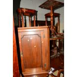 AN EARLY 20TH CENTURY PANELLED OAK HANGING CORNER CUPBOARD and a mahogany tripod table (2)