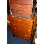 A TALL 1960'S TEAK CHEST OF FIVE DRAWERS, with shaped brassed handles on four cylindrical legs,