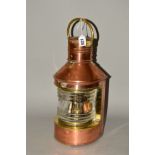 A VINTAGE COPPER AND BRASS SHIPS MASTHEAD LANTERN, fitted with the original burner, height with