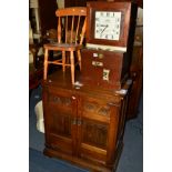 AN OLD CHARM OAK TWO DOOR CABINET together with an elm childs chair (2)