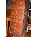 AN EARLY 20TH CENTURY STAINED WOOD CHEST OF EIGHT DRAWERS, width 50cm x depth 39.5cm x height 105cm