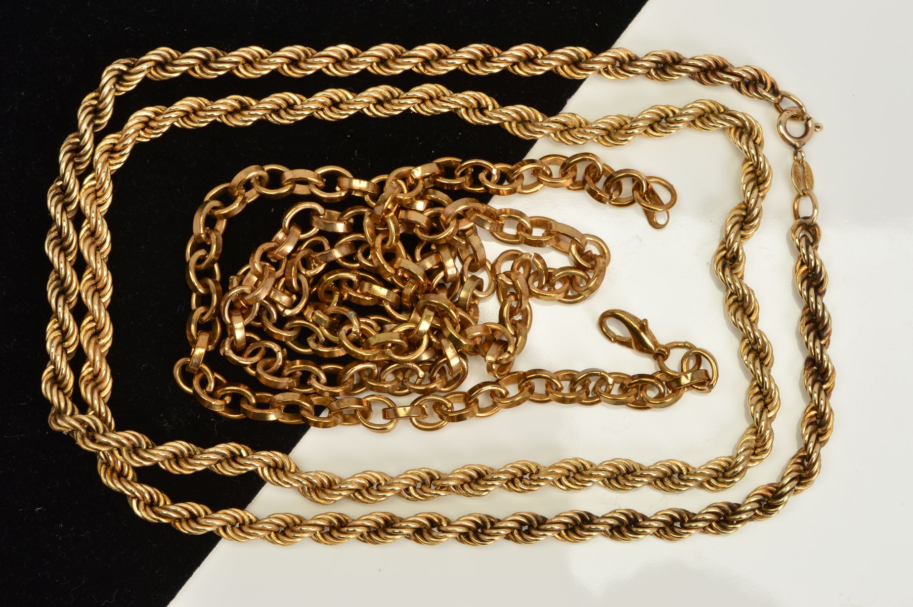 A 9CT GOLD CHAIN NECKLACE AND A GOLD PLATED CHAIN NECKLACE, the 9ct gold chain of rope twist