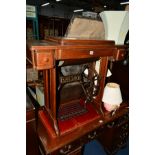 A SINGER TREADLE SEWING MACHINE