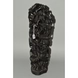 A CARVED AFRICAN HARDWOOD TREE OF LIFE, depicting figures standing on top of one another, on a