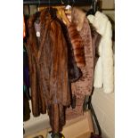 A 3/4 LENGTH FUR JACKET, two fur stoles (one with tails), a coat with fur trim collar, a waistcoat