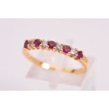 AN 18CT DIAMOND AND RUBY RING, designed as a half eternity ring, featuring four round brilliant