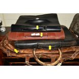 A BROWN LEATHER SUIT BAG together with three various briefcases (4)