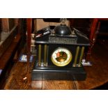 AN EDWARDIAN SLATE MANTEL CLOCK, inscribed Howell Oxford, enamel dial and Arabic numerals