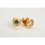 A PAIR OF DIAMOND STUD EARRINGS, each designed as a round brilliant cut diamond within a collet