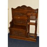 AN EARLY 20TH CENTURY CARVED OAK HALL SEAT/STICK STAND, fitted with a single drawer, the seat with