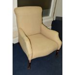 AN EARLY 20TH CENTURY EASY CHAIR, cream calico upholstered, on tapering cylindrical front legs and