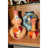 TWO CROWN DUCAL WARE LUSTRE VASES, decorated with fruit, one of double gourd shape, height 27cm, the