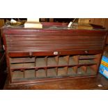 AN EARLY 20TH CENTURY MAHOGANY TABLE TOP TAMBOUR FRONT CABINET, revealing varous shelving/pigeon