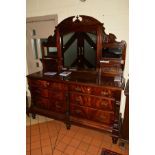 A LATE VICTORIAN MIRROR BACK SIDEBOARD, the arched back with foliate carved decoration and fitted