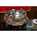 A GEORGE V SILVER SCALLOP SHELL SHAPED DISH, on three cabriole legs with paw feet, maker Henry